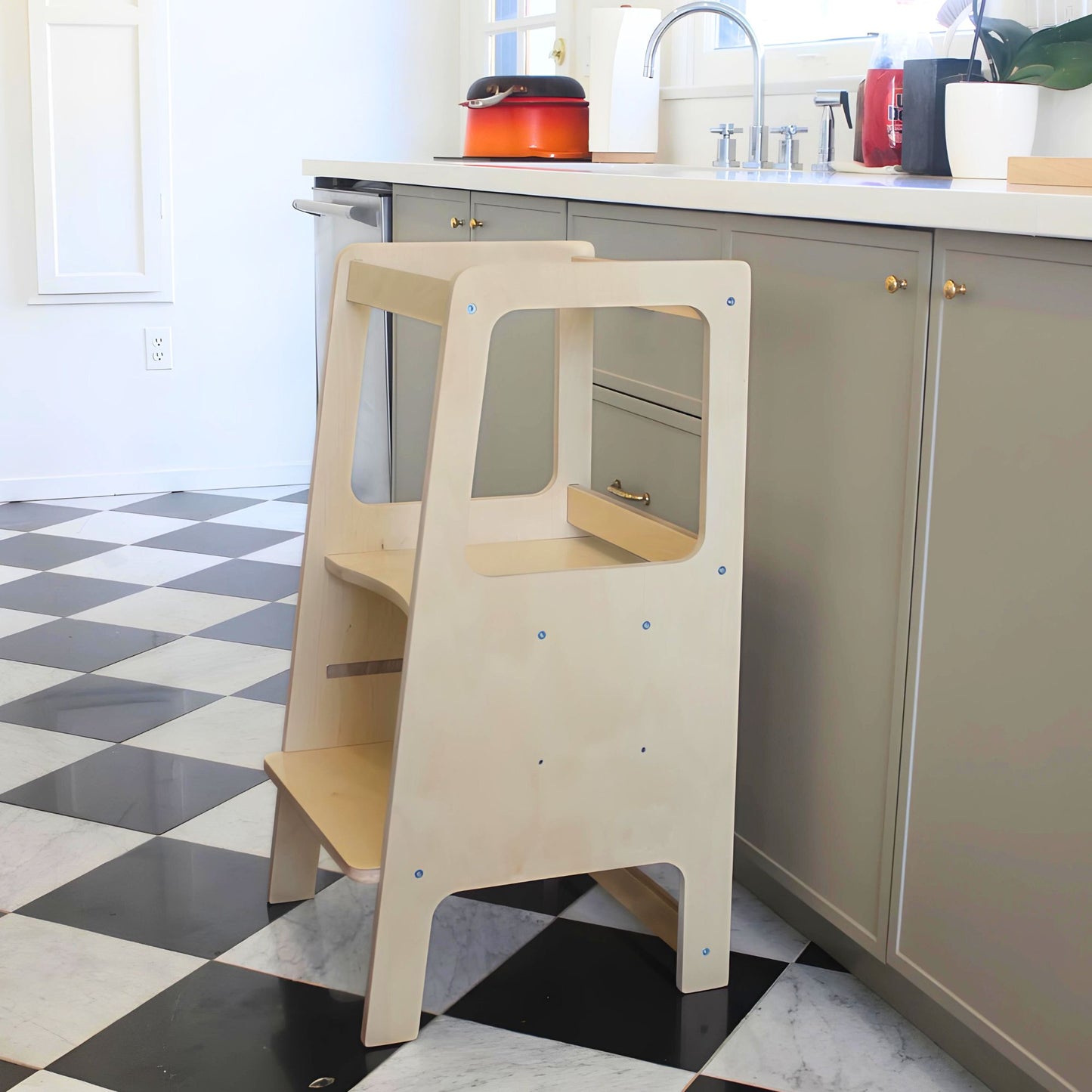 learning tower in a kitchen with natural light