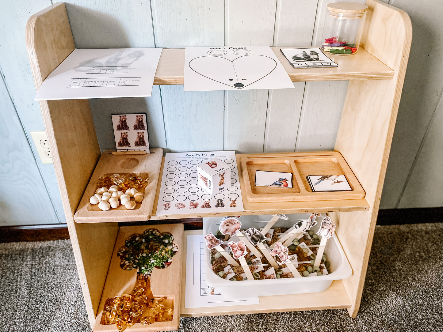 tiered toy shelf with materials