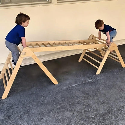 two pikler triangles joined together with a ladder
