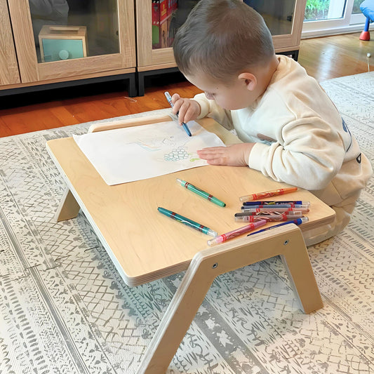 Boy drawing on the Chowki Table