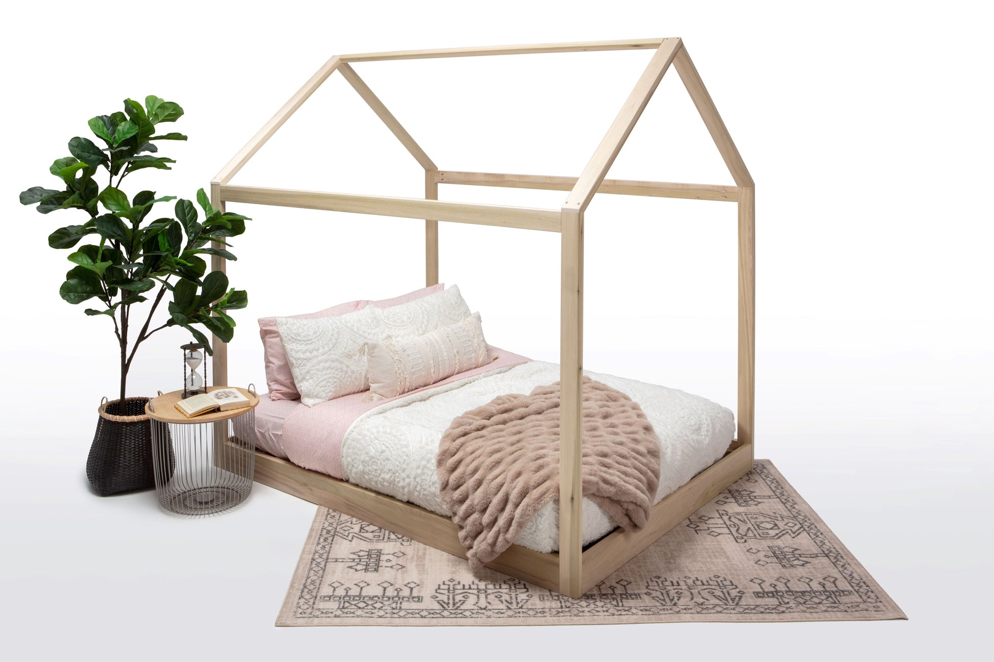The Ozarks House Bed with a pink cover Side view