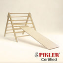 Short climbing board on pikler triangle. Wooden Montessori climber.