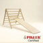 Short climbing board on pikler triangle. Wooden Montessori climber.