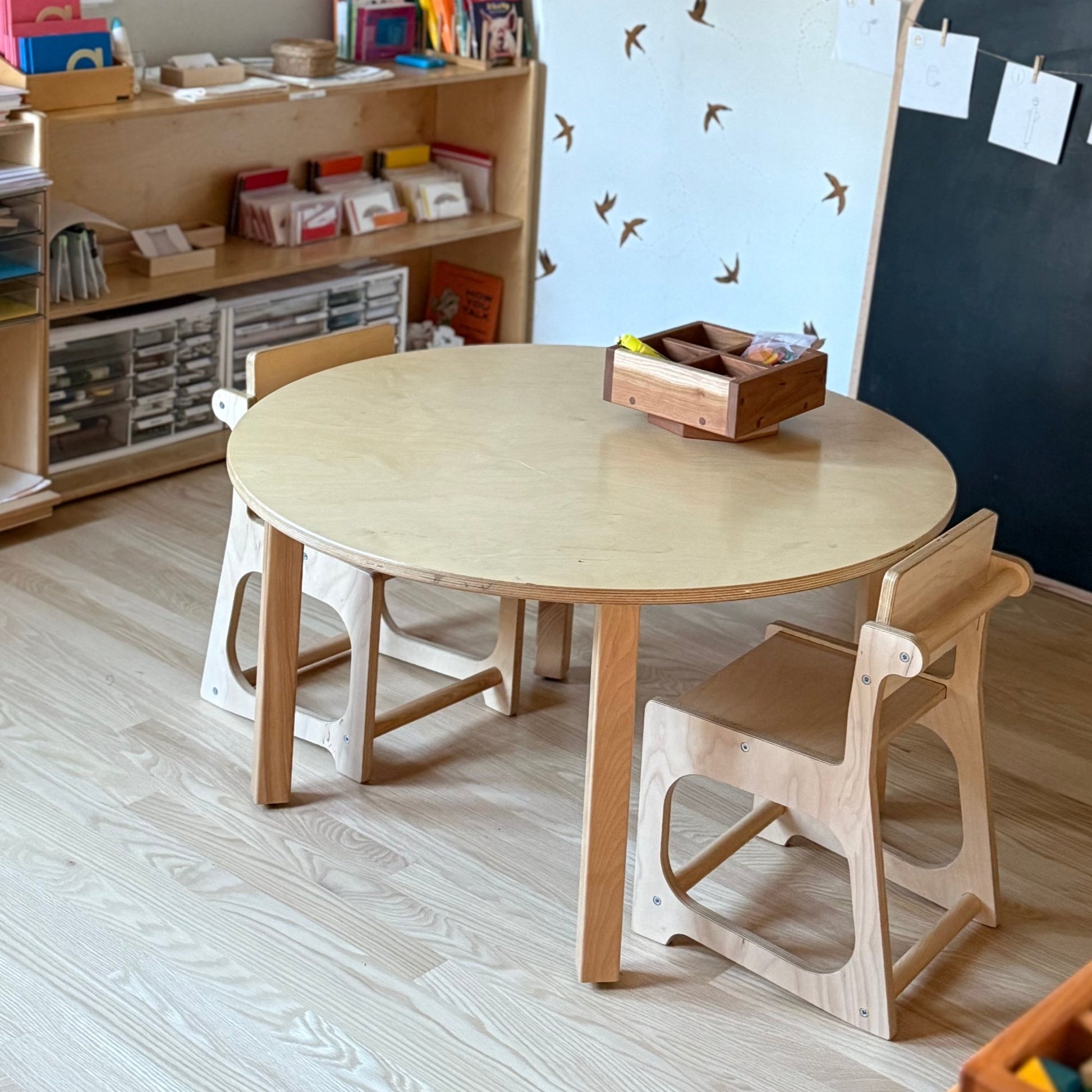 wooden preschool chairs at round montessori table