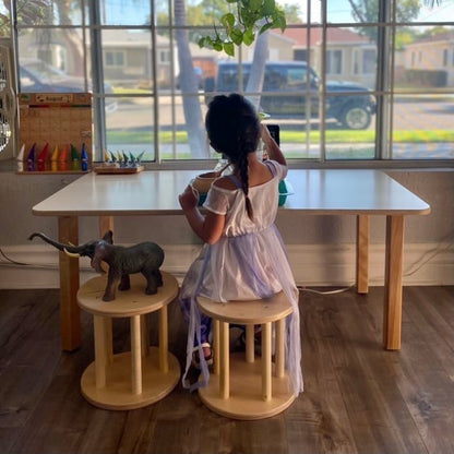 wooden children's stool at large montessori table