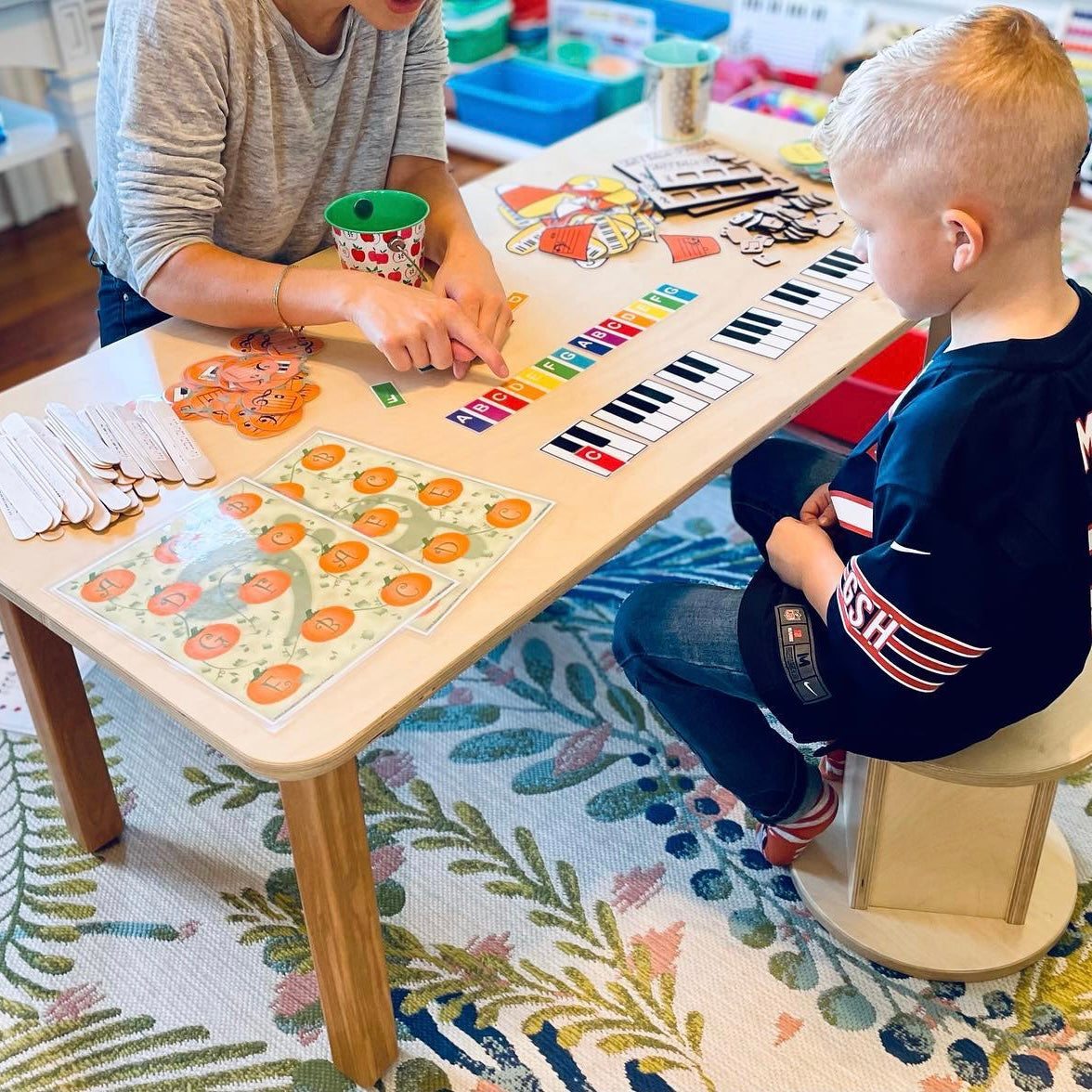 rectangle table being used for piano lessons