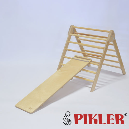 Short climbing board on pikler triangle. Wooden Montessori climber.